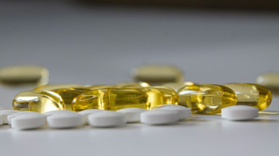 a close up of many pills on a table